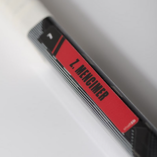 Close-up of a red and black label MENGIMED on it. Just like the pros Decal